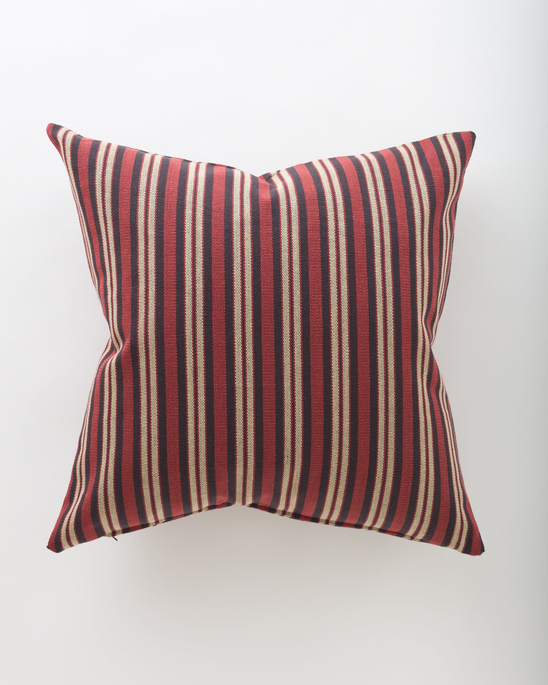 The Pindler Hestia 26x26 is a square pillow with red, black, and beige vertical stripes and a plush insert, shown against a plain white background.