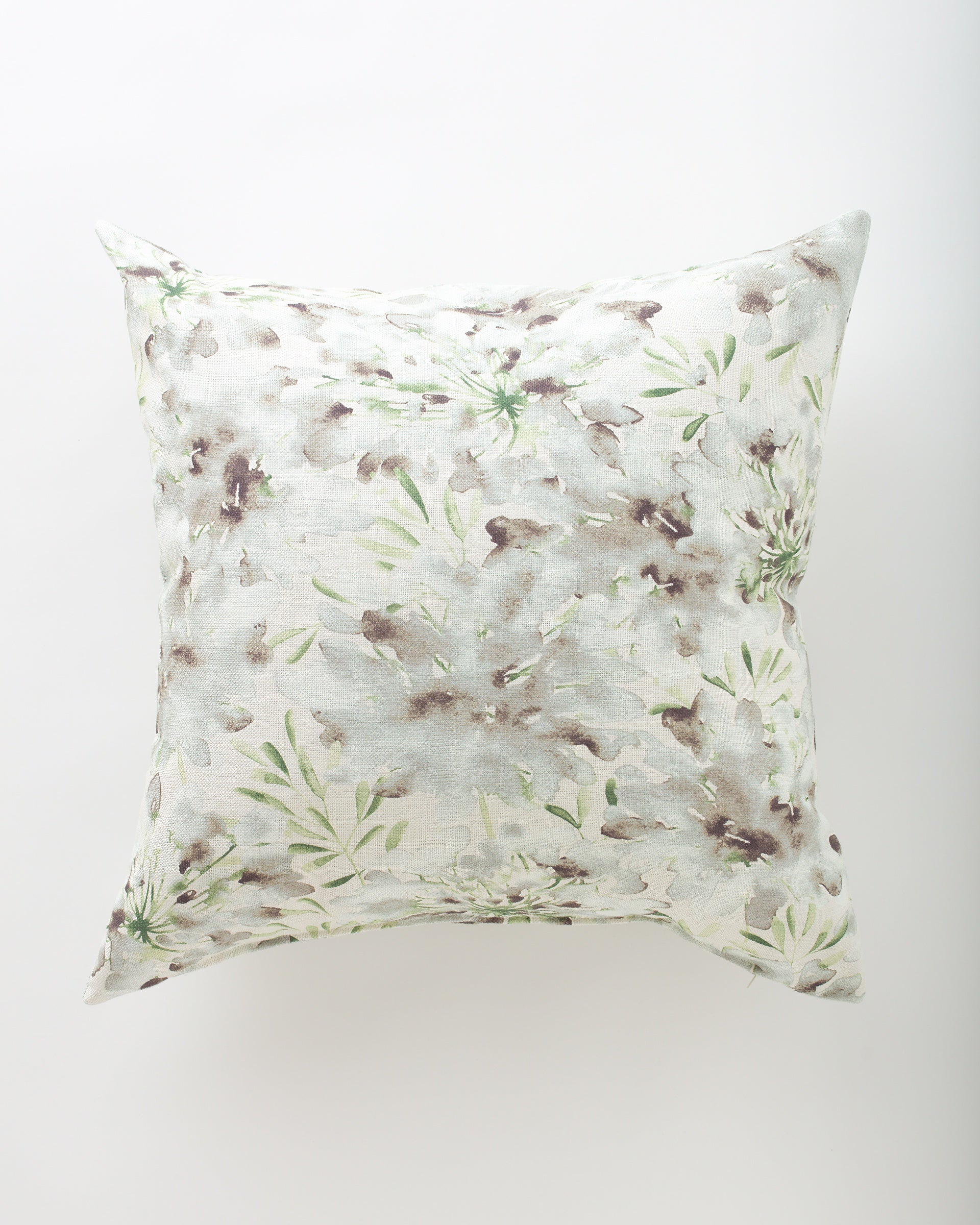 The Pindler Zola 26x26 euro pillow features a subtle watercolor-style floral pattern in green and brown on a light background, adding a touch of luxury. Photographed against a plain white surface.