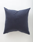 The Orla 26x26 by Pindler features a dark blue background with thin, evenly spaced vertical white stripes—an elegant choice for elevating your euro pillows collection.
