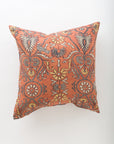 The Amika 26x26 pillow by Pindler features an intricate orange, yellow, and gray floral and geometric pattern on a light background with hearts, flowers, and symmetrical shapes—ideal to pair with your favorite insert for added comfort.