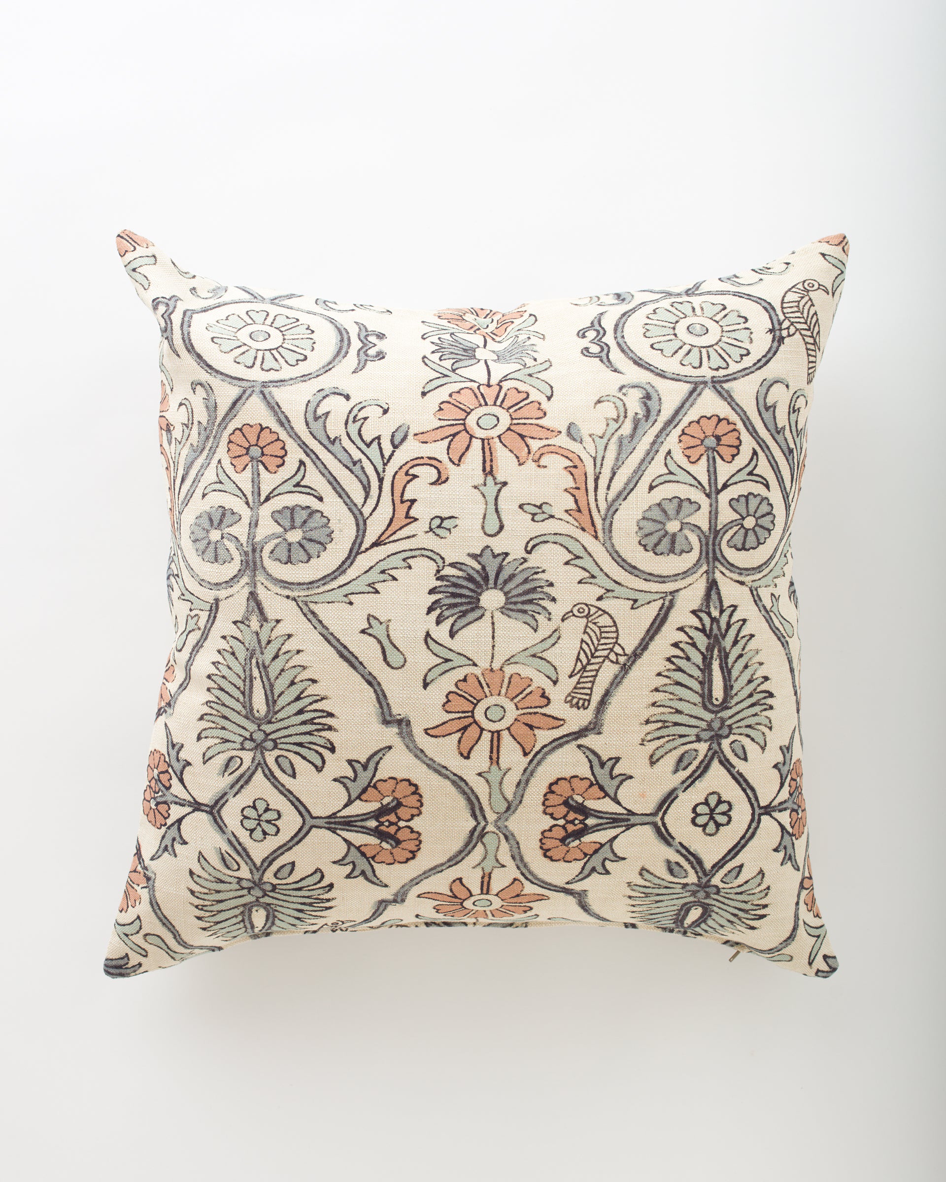 The Amika 26x26 pillow by Pindler features an ornate floral and leafy pattern in muted orange, gray, and beige on a cream background—perfect for pairing with euro pillows to create a coordinated, luxe look.