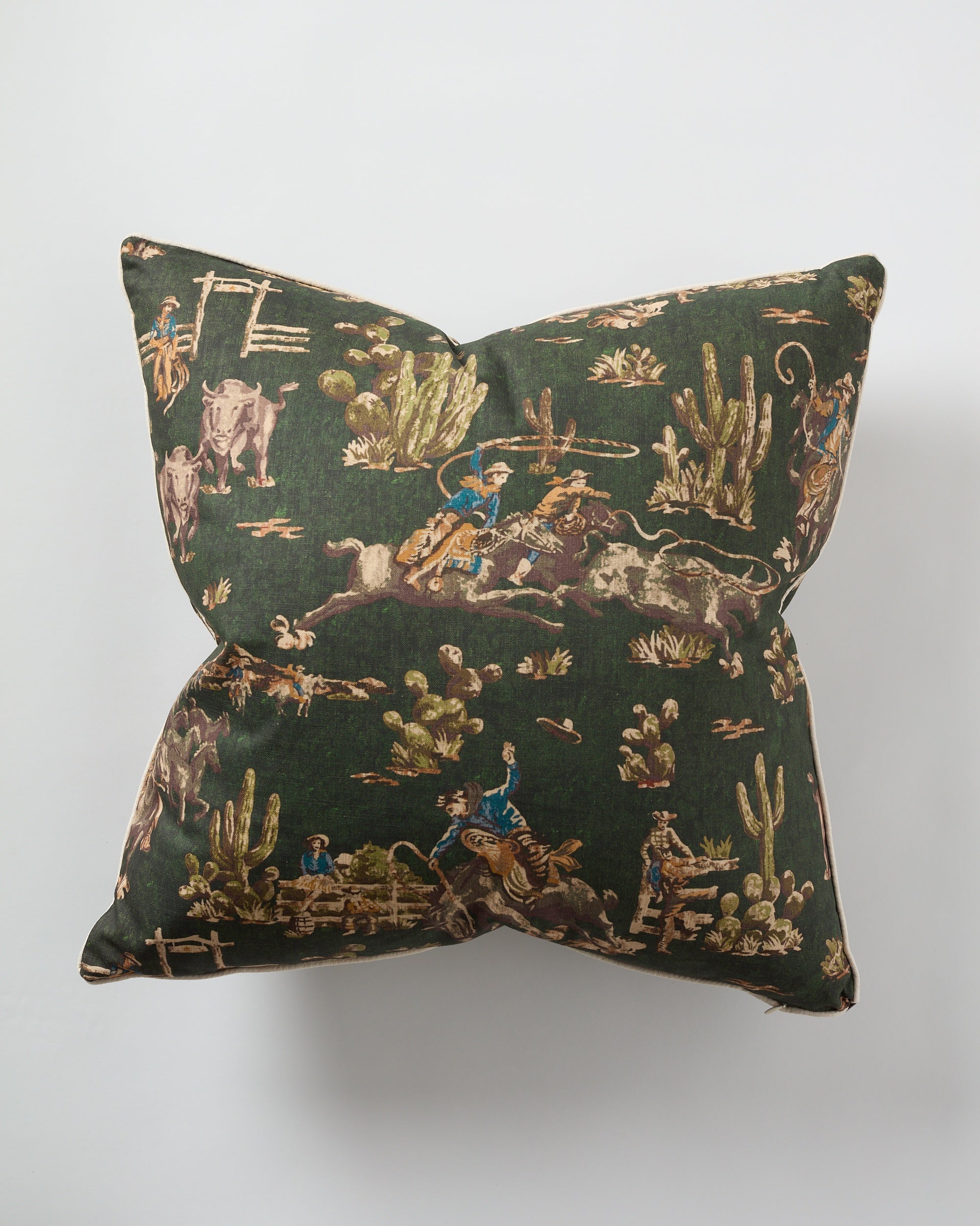 The Green Cowboy Pillow 26x26 by Design Legacy features a dark green vintage western pattern with cowboys, cattle, and cacti on white—ideal as a custom accent for rustic or western-inspired decor.