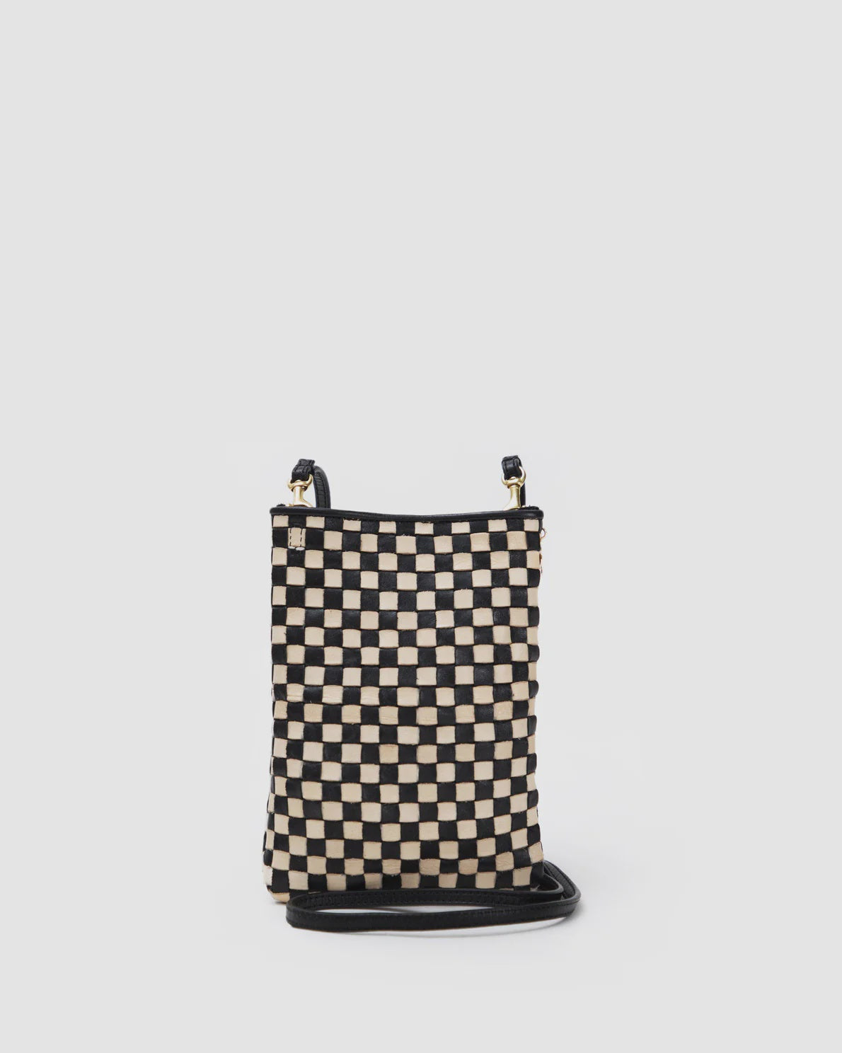 A small, rectangular shoulder bag with a black and beige checkered pattern on the front. It features a black crossbody strap attached at the top corners and a black trim around the edges. The background is plain white. This is the Poche by Clare Vivier.