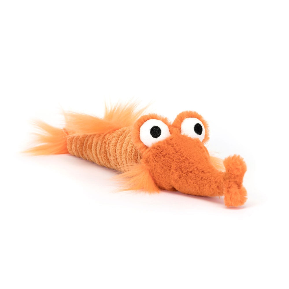 The Riley Razor Fish by Jelly Cat Inc. is a whimsical, plush toy made from orange cordy fabric. It resembles an orange shrimp with large googly eyes, featuring a fluffy texture, long segmented body, fuzzy tail, and elongated snout for a playful appearance.