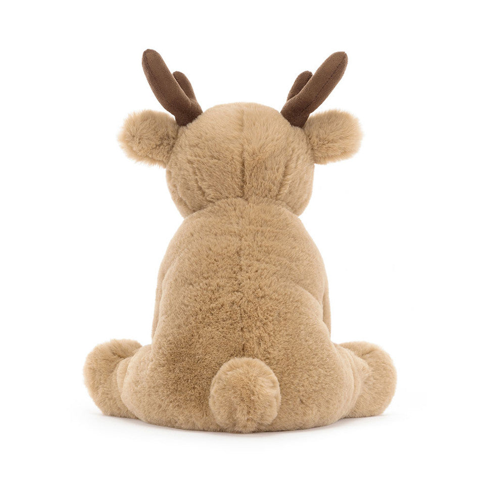 The Romi Reindeer plush toy by Jelly Cat Inc. features soft brown fur, round ears, dark brown antlers, and a fluffy tail—an adorable Christmas companion shown from the back against a plain white background.