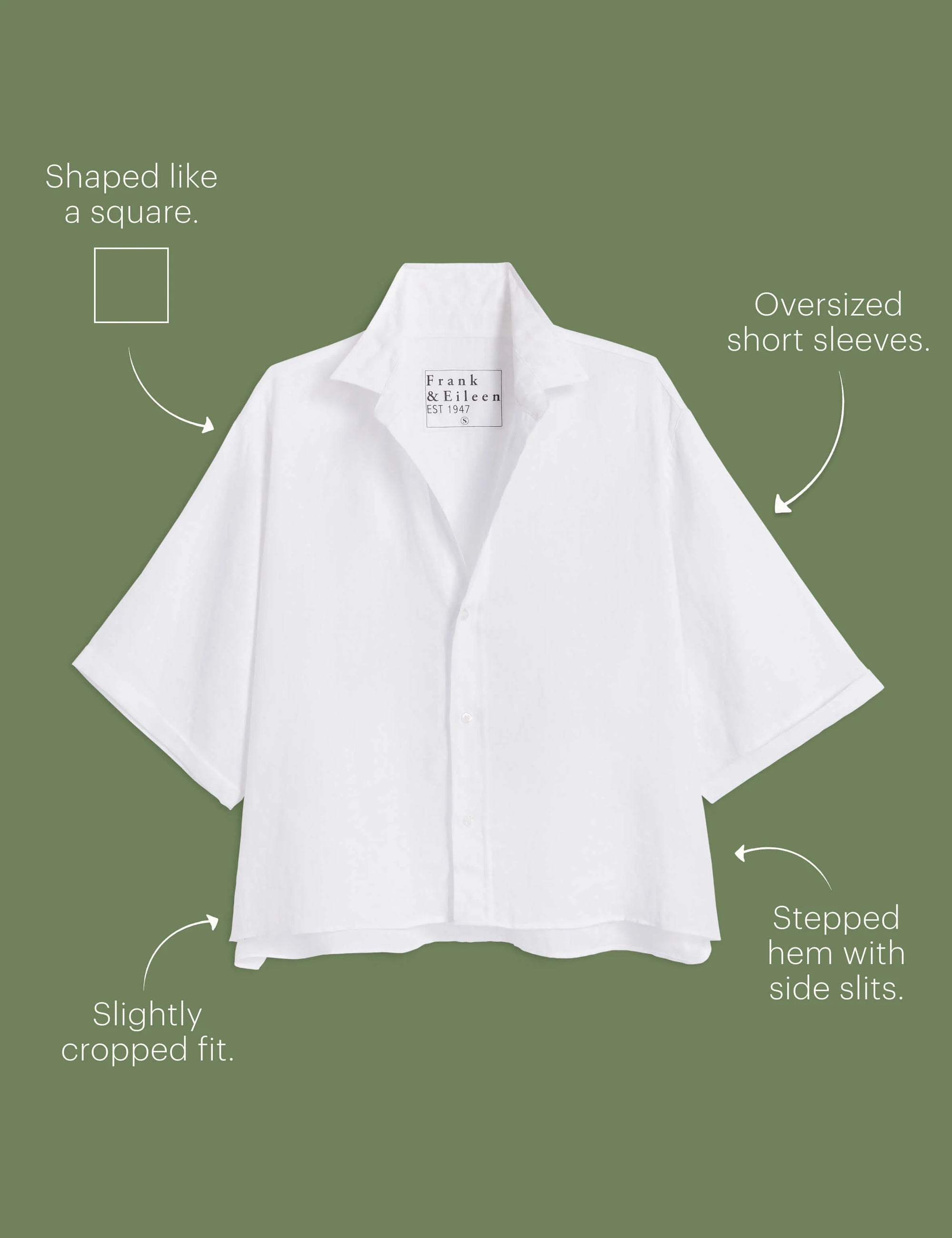 The ROSIE SS Button Up F25 by Frank & Eileen is a white, short-sleeve button-up with an oversized, cropped fit, split seams, side slits, and a stepped hem, shown on an olive green background with labels.