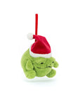 A Ricky Rain Frog Decoration by Jelly Cat Inc. hangs by a red loop against a white background, featuring a plush green grumpy frog wearing a red and white Santa hat.