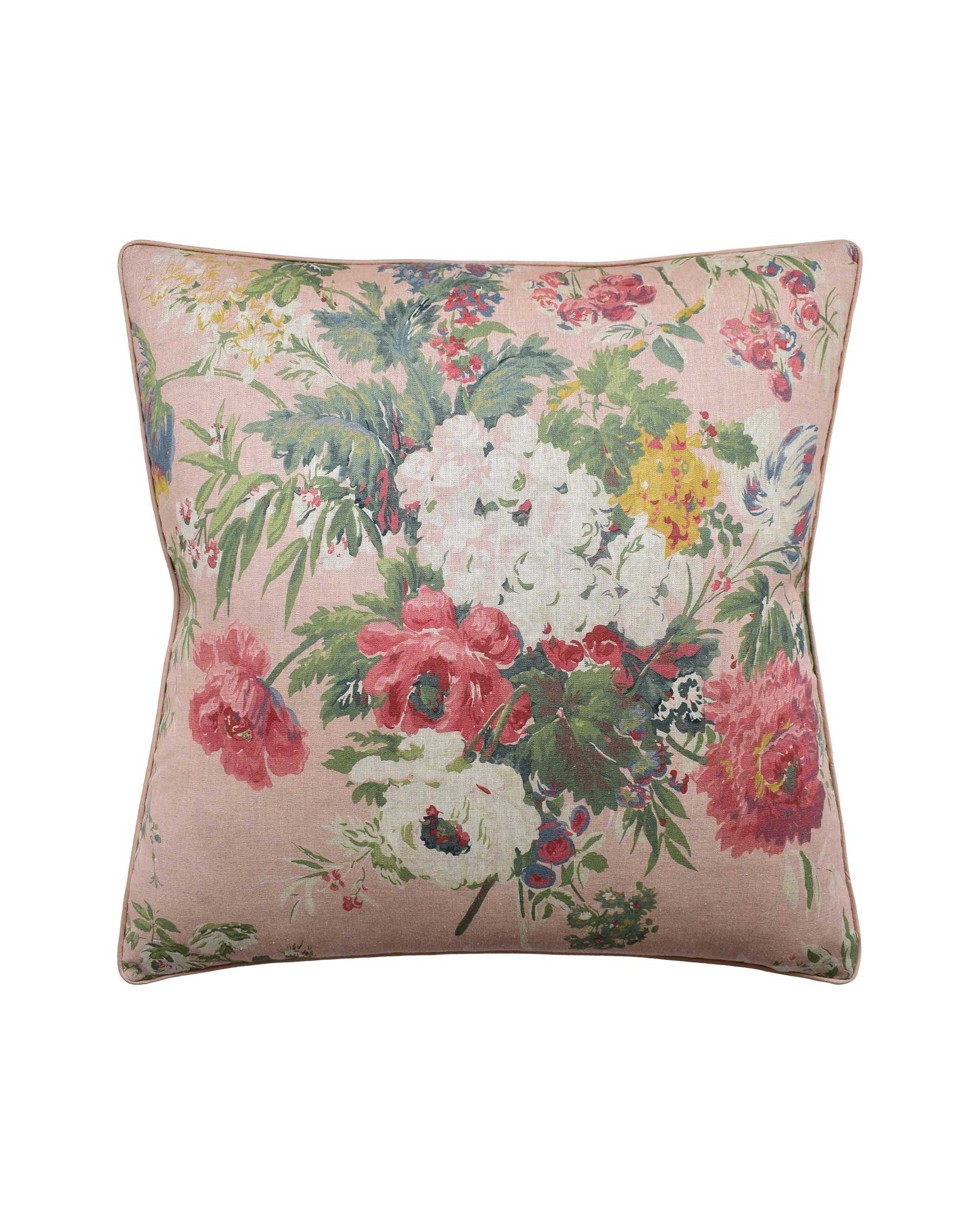 The Garden Club Blush pillow cover by Ryan Studio features a vibrant floral pattern on a pink background with red, white, yellow, and green accents. This 22" x 22" linen cover is finished with stylish contrast piping for a chic touch.