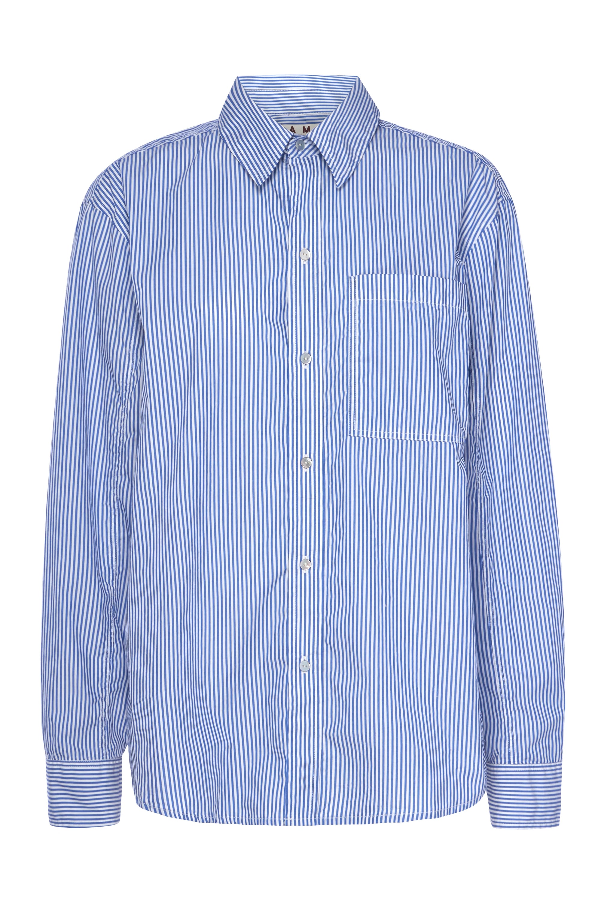 The Ruth Oversized Shirt by AMO Denim is a blue and white vertically striped button-up shirt made from cotton poplin. It features long sleeves and includes a chest pocket.