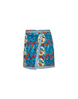 The Powell Skirt by Hunter Bell NYC is a vibrant wrap crafted in stretch sateen, showcasing an Orange Grove print with a bright blue background and circular fruit and leaf patterns. It features chic blue-and-white stripe details on the hem and waist.