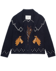 The Great Inc. Horse Lodge Cardigan in navy features white patterns, two hand-embroidered horses on the front, a shawl collar, visible neckline label, and a western-inspired design.