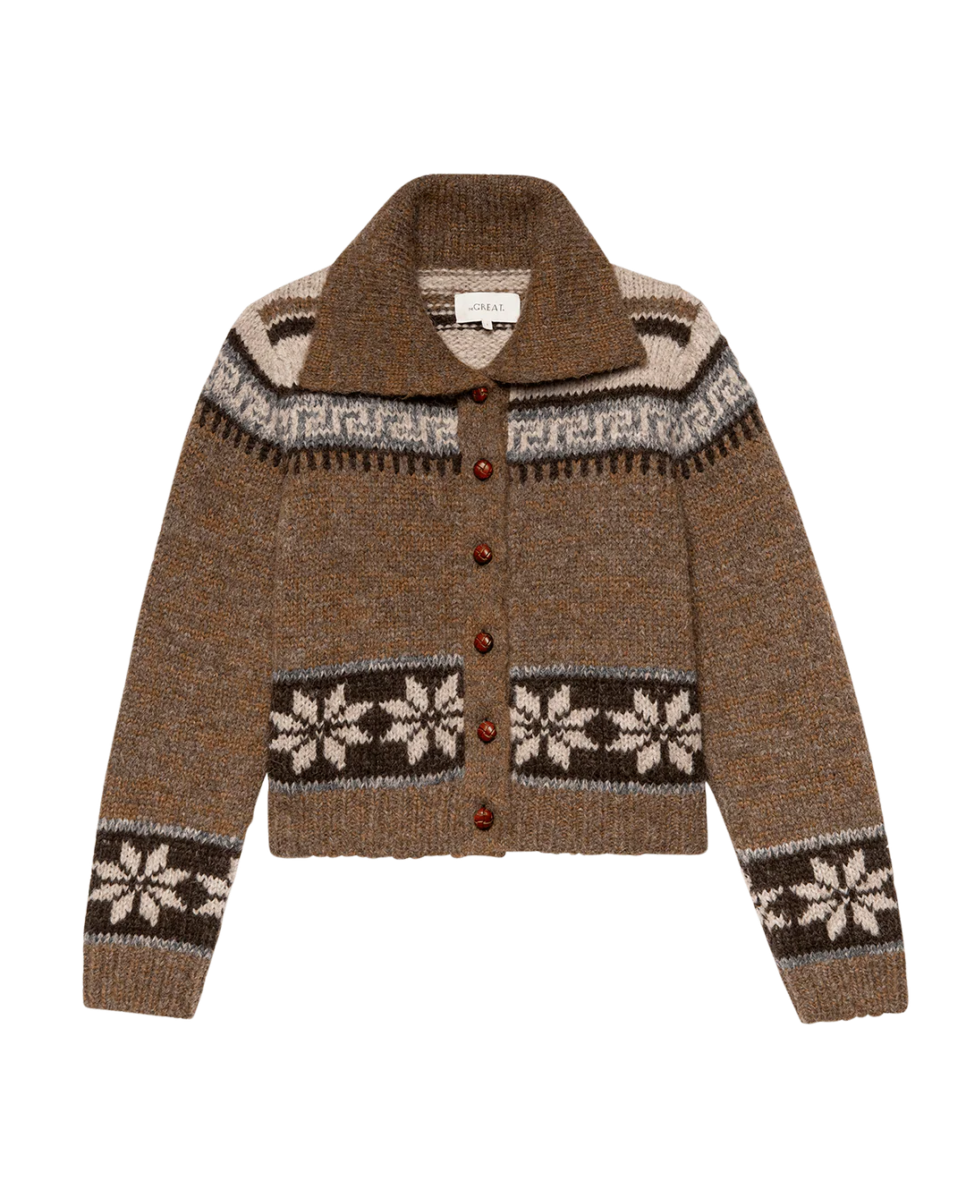 The Nordic Scholar Cardigan by The Great Inc. is a brown wool piece featuring a wide collar, button-down front, and white and dark brown Nordic snowflake motifs—a cozy tribute to classic knitwear.