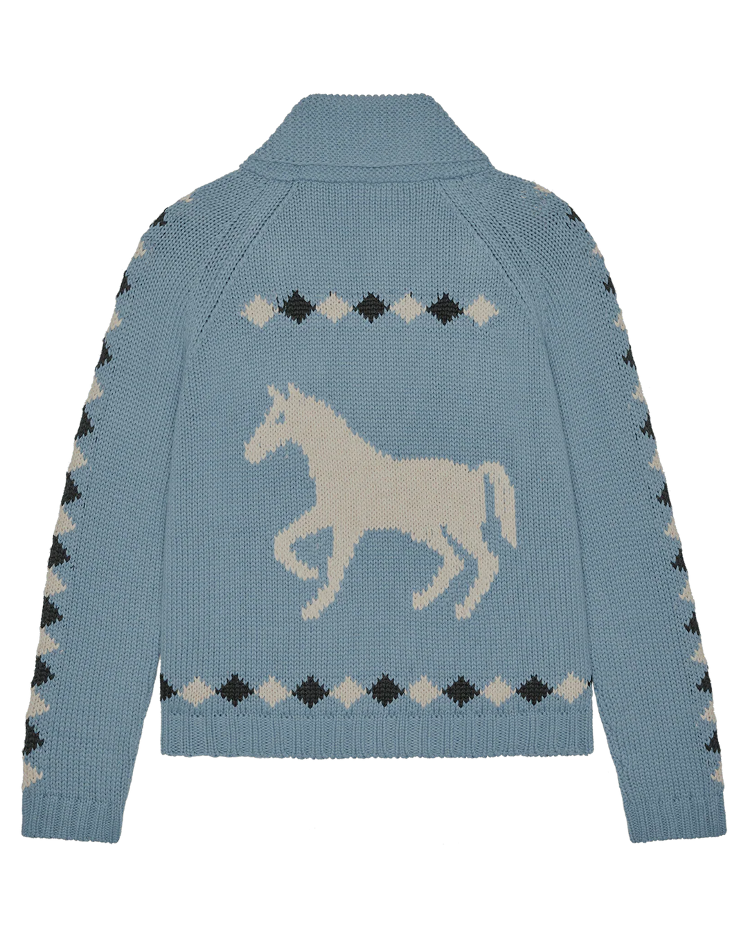 The Stable Lodge Cardigan by The Great Inc. is a light blue knit with a bold white western horse motif on the back, framed by black, white, and gray diamond patterns along the sleeves and back.