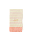 A folded cream-colored blanket with pink horizontal stripes is bordered with a pink ruffle at the bottom. A small yellow tag on the front reads "My Little Guy." Perfectly complement it with a pack of 24 My Mind's Eye Guest/Dinner Napkins for a charming and cohesive look.