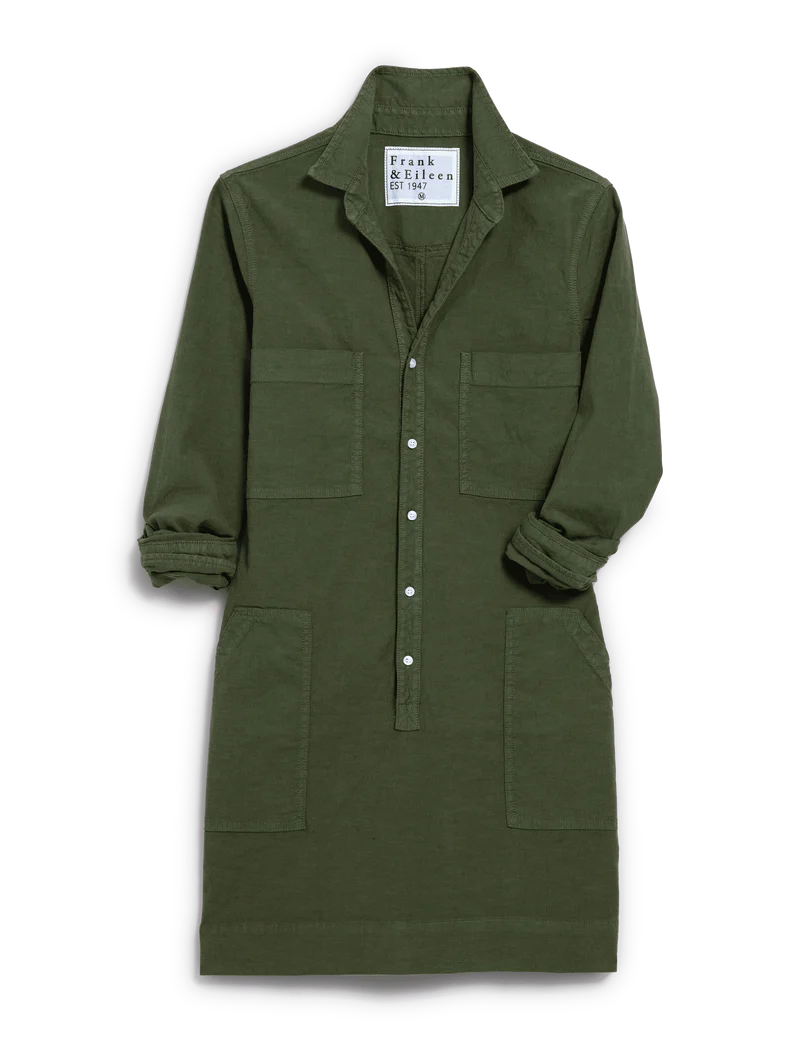 The Frank & Eileen Southern Dress is an olive green Italian Performance Linen mini dress with a collar, button-up front, two chest and two lower front pockets, and rolled sleeves. A label appears inside the collar.