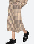 A person wearing the Sea New York Savannah Plaid Culotte with a matching top and black leather lace-up shoes stands against a plain white background.