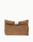 Cigar suede clutch with fold-over top, metallic clasp, and draped metal cuff by Staud.