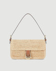 The Staud Harlow Raffia Bag in Natural features a rectangular woven design, a brown leather strap, and a gold moon buckle clasp on the front, shown against a plain white background.