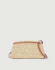 The Staud Maude Convertible Clutch in natural features a small, rectangular woven raffia design with brown leather trim and a convertible leather shoulder strap, shown against a plain white background.