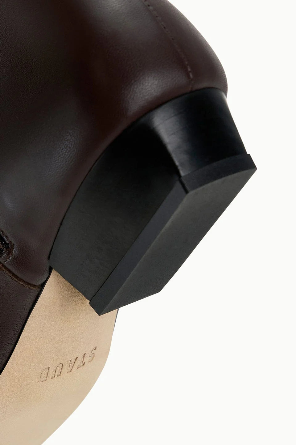 Black Staud Wally Sock Flat Ankle Boot with pointed toe, geometric heel, and branded sole.