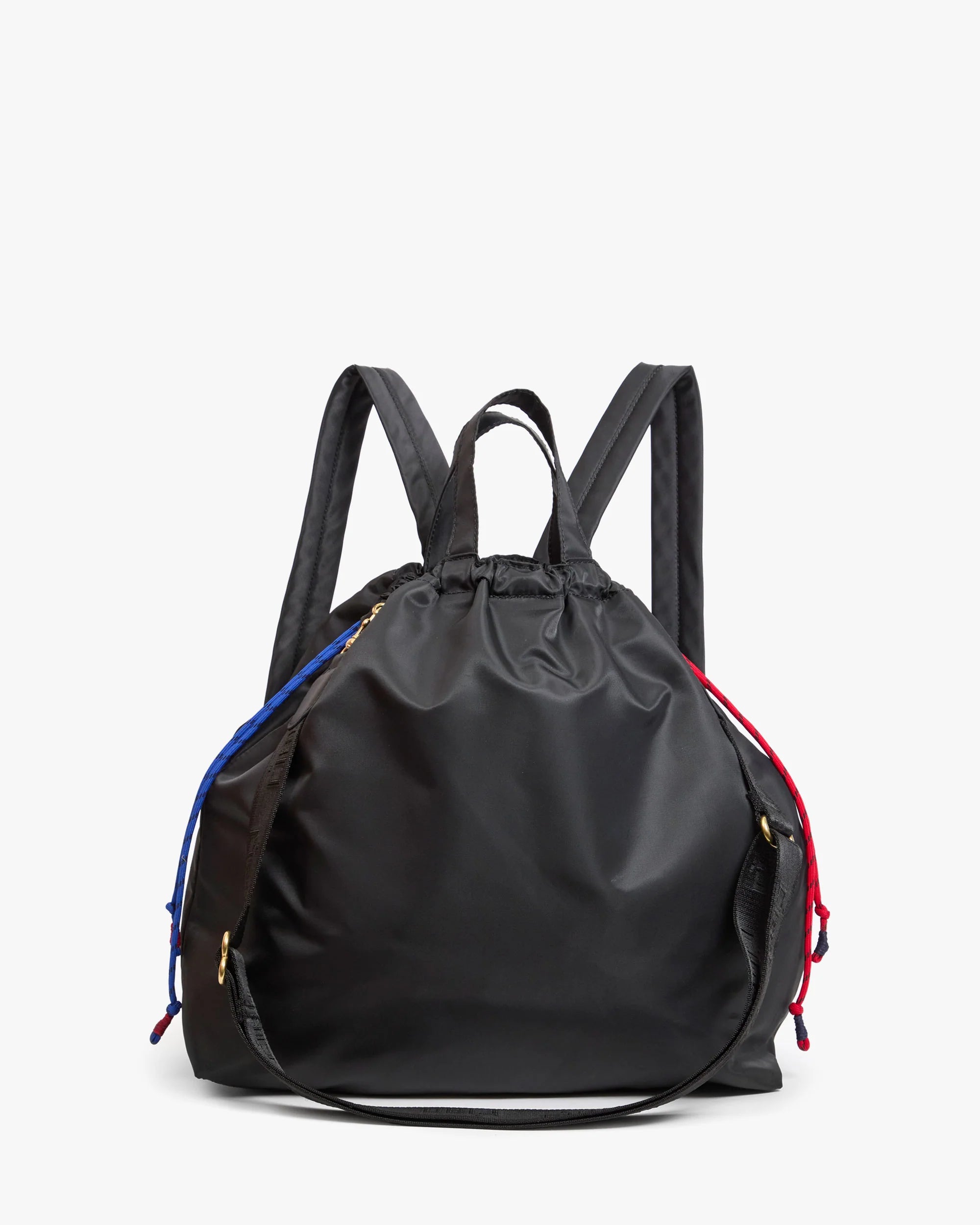 The Clare Vivier Sac Tout Backpack is made of black recycled nylon with a drawstring closure, two adjustable straps, and blue and red cords on each side, shown against a plain white background.