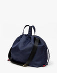 Navy drawstring bag with handles and adjustable strap by Clare Vivier, Sac Tout Navy, available at Bungalow Furniture.
