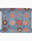 A Faire Medium Tray with a blue background featuring a traditional Asian-inspired pattern of red and white floral designs and ornamental motifs, perfect for a Scottsdale Arizona bungalow.
