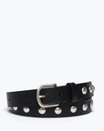 Introducing the Rebecca Black Calf Belt by Freda Salvador: A stylish and edgy accessory crafted from certified Spanish leather by the Leather Working Group. This black leather belt features a sleek silver buckle and two rows of evenly spaced, round silver Italian metal studs along its length, coiled in a chic loop.