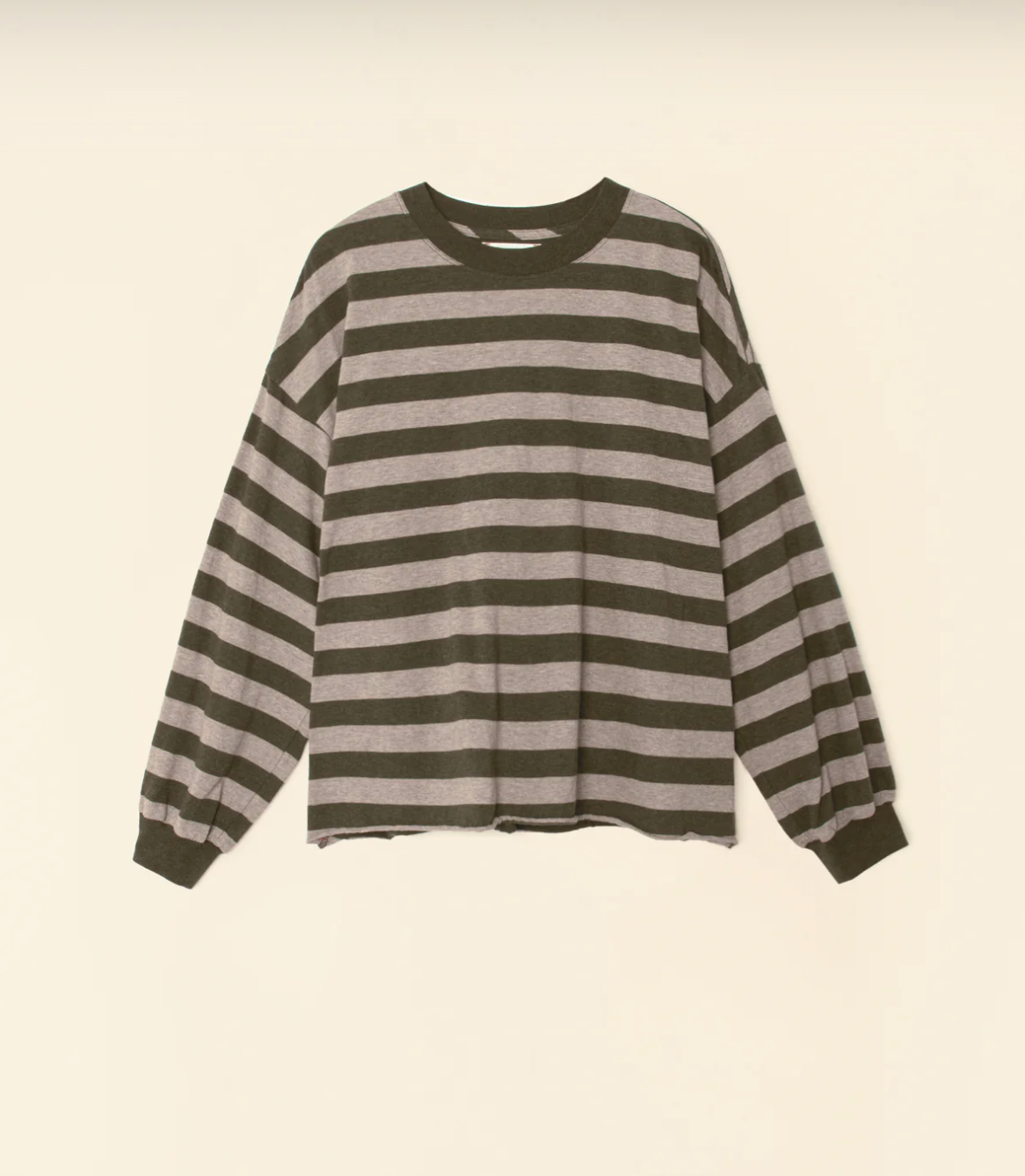 Discover the Honor Tee by Xirena: a long-sleeved, crew-neck shirt featuring black and grey wide horizontal stripes. Crafted from 100% cotton, this tee offers a relaxed fit with slightly loose sleeves and banded cuffs. Its simple, casual design is enhanced by a modern, slightly cropped raw hem.