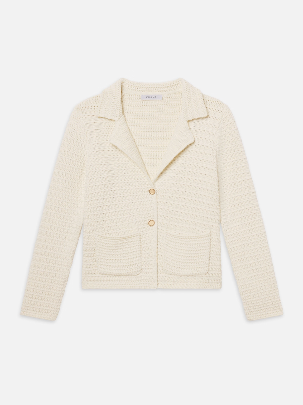 The FRAME crochet blazer is cream-colored with long sleeves, a subtle striped pattern, notched collar, two front patch pockets, and a two-button closure. Ideal for summer workwear.