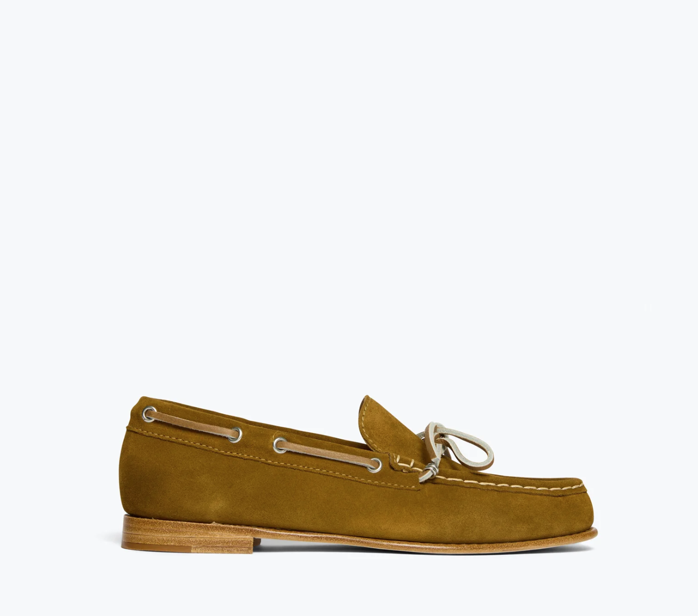 The MORGAN Loafer by Freda Salvador is a single tan suede shoe styled after classic Italian leather boat shoes, with a brown leather sole and white laces woven through the sides and tied at the front, set against a light gray background.