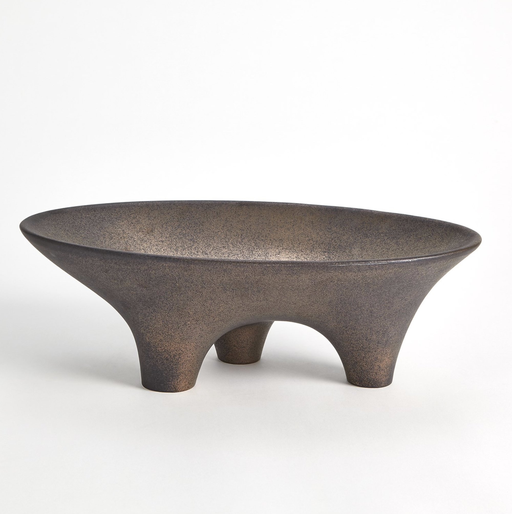 The 7.10465 Opus Triple Leg Bowl by Global Views is a wide, shallow clay bowl with a matte textured finish and three rounded legs—an artisan piece from Portugal that stands out against a plain white background.