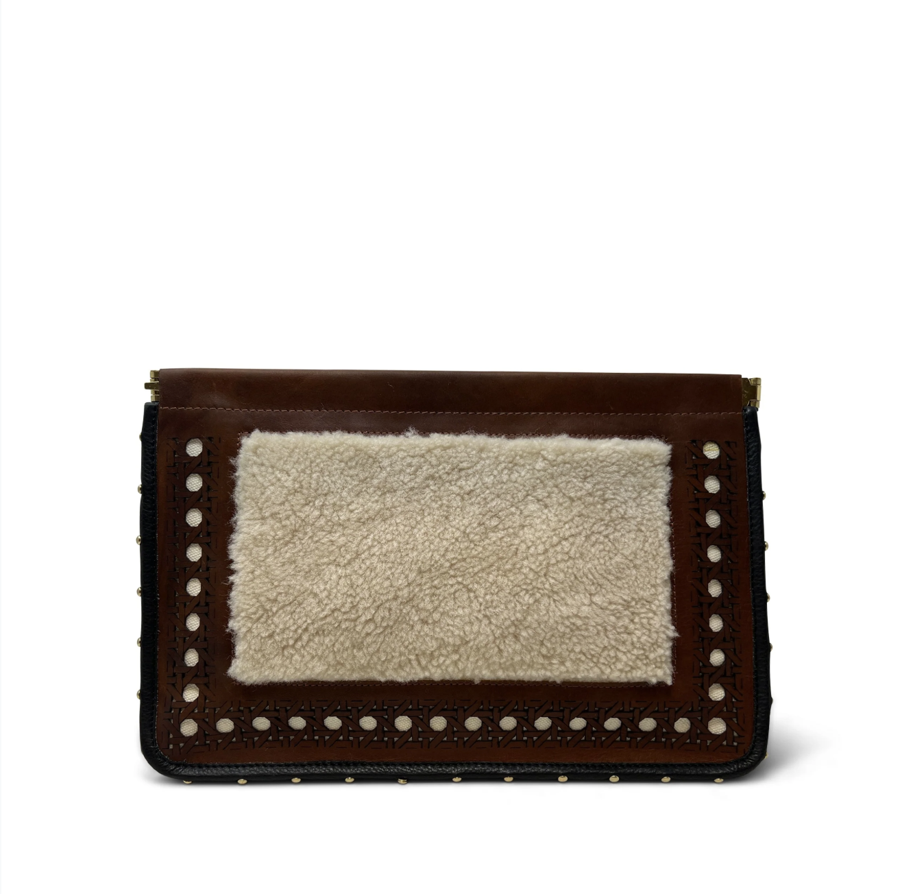 The Kempton & Co. Snap Clutch - Leather Rattan features a rectangular shape with leather trim, rattan panel, black sides, and chic metal stud accents for a stylish textured purse look.