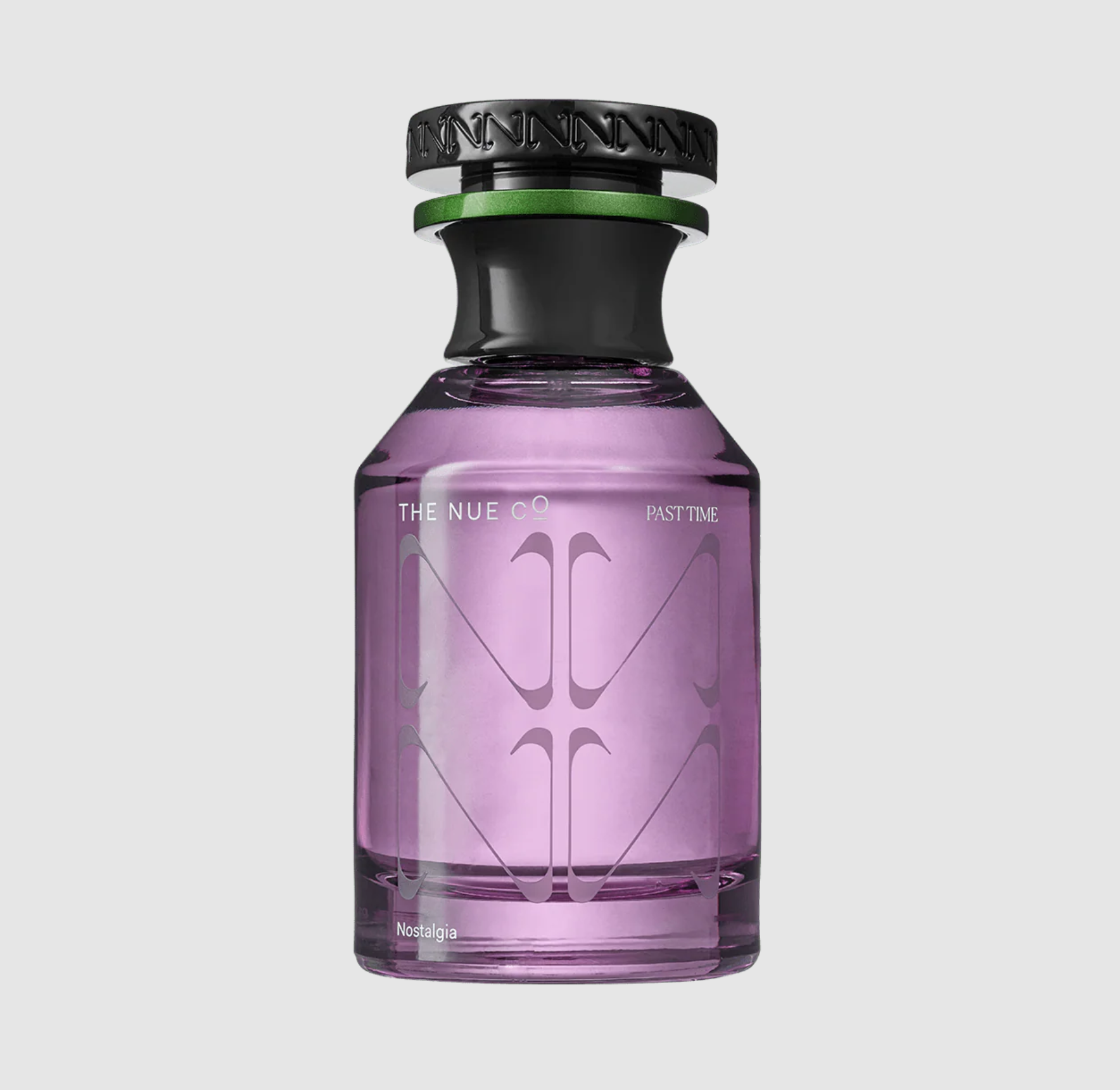 A purple glass "Past Time 50 ML Fragrance" bottle from The Nue Co features a black and green cap, "Nostalgia" at the base, and sandalwood with vetiver notes. The scene is set against a light gray background.