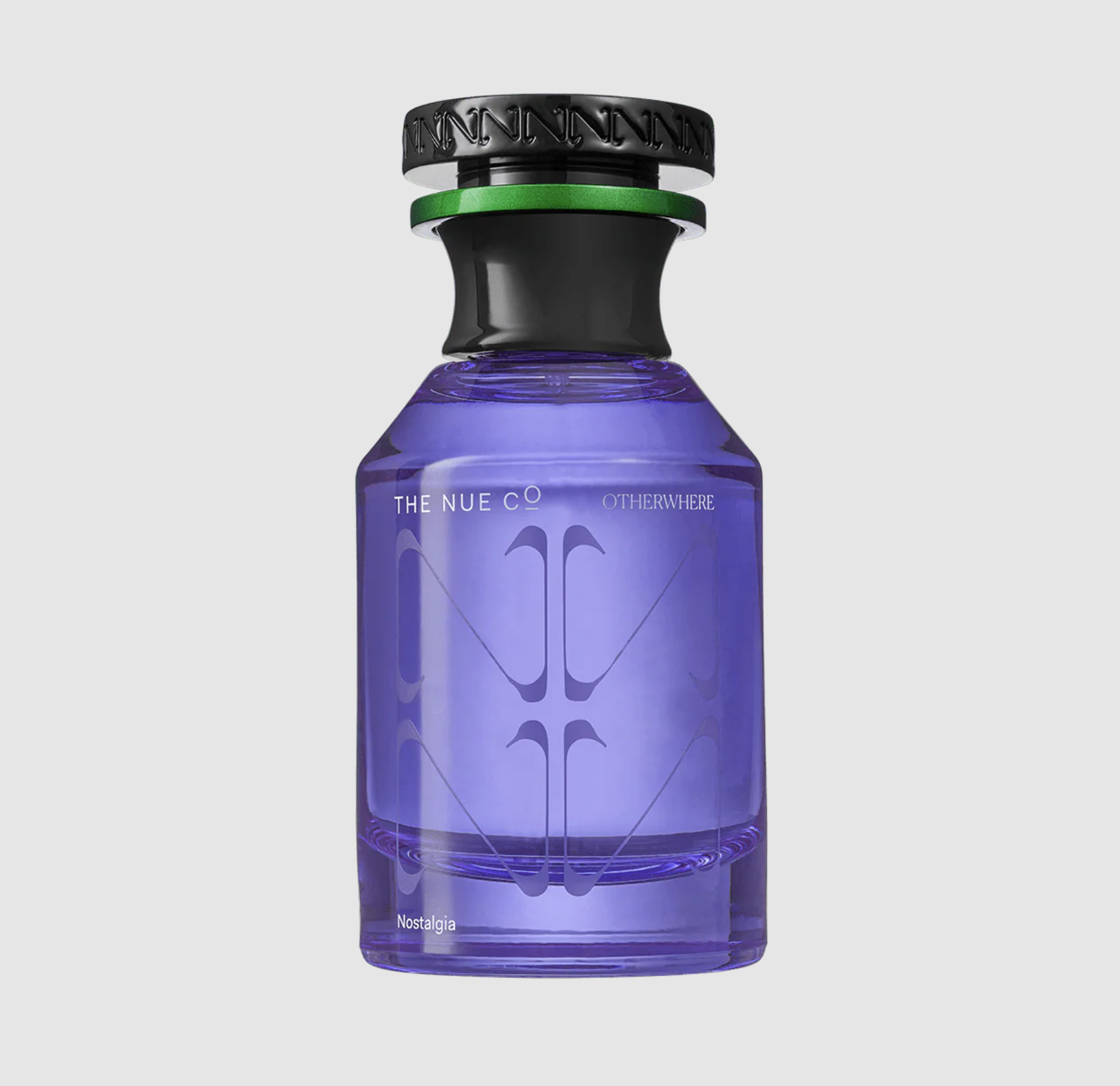 A purple glass bottle labeled "The Nue Co" and "Otherwhere 50ML Fragrance," with a black and green cap, sits on a plain gray background. "Nostalgia" near the base hints at gentle oud and creamy sandalwood notes.