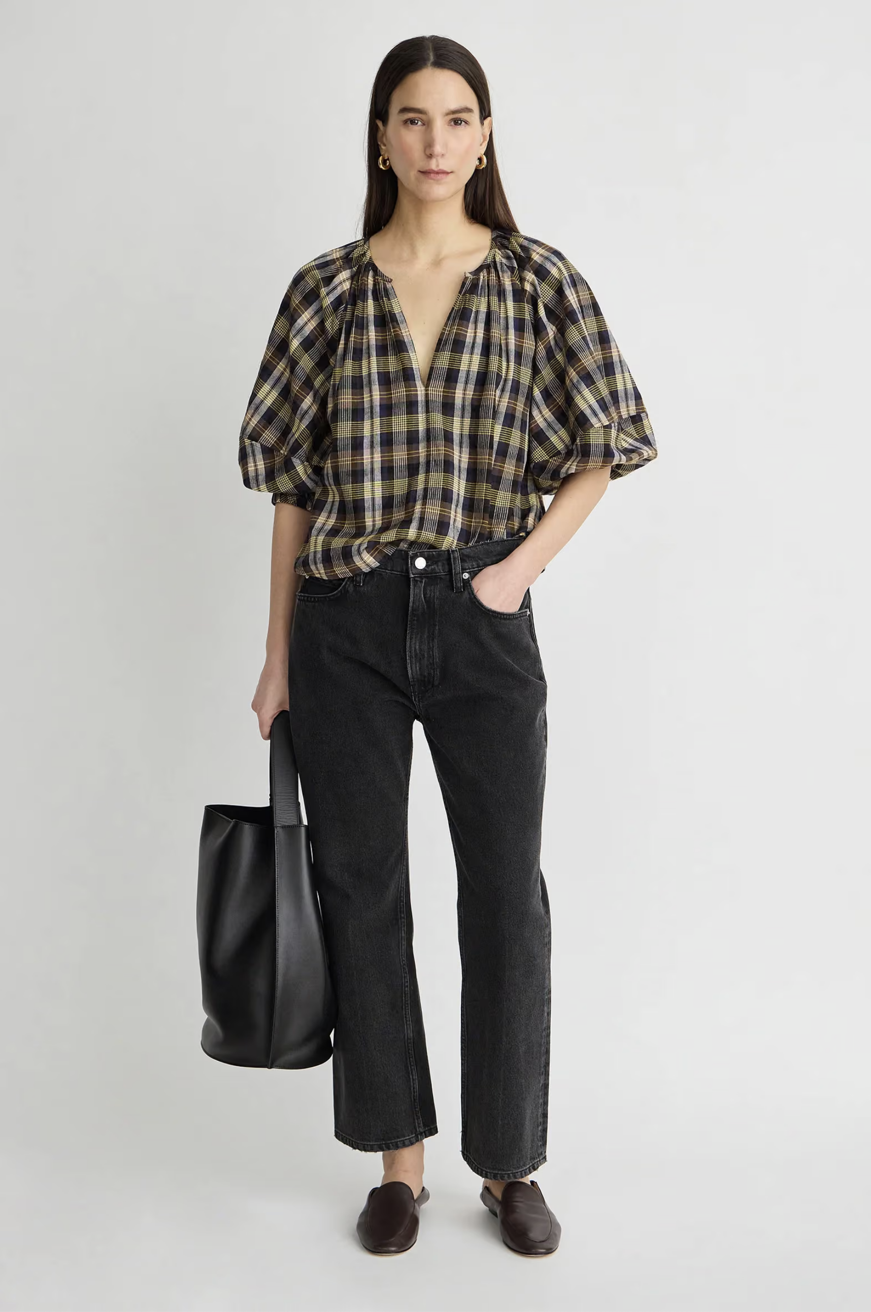 Apiece Apart Nele Lantern Sleeve Top in white, styled with black jeans and loafers, casual modern look.