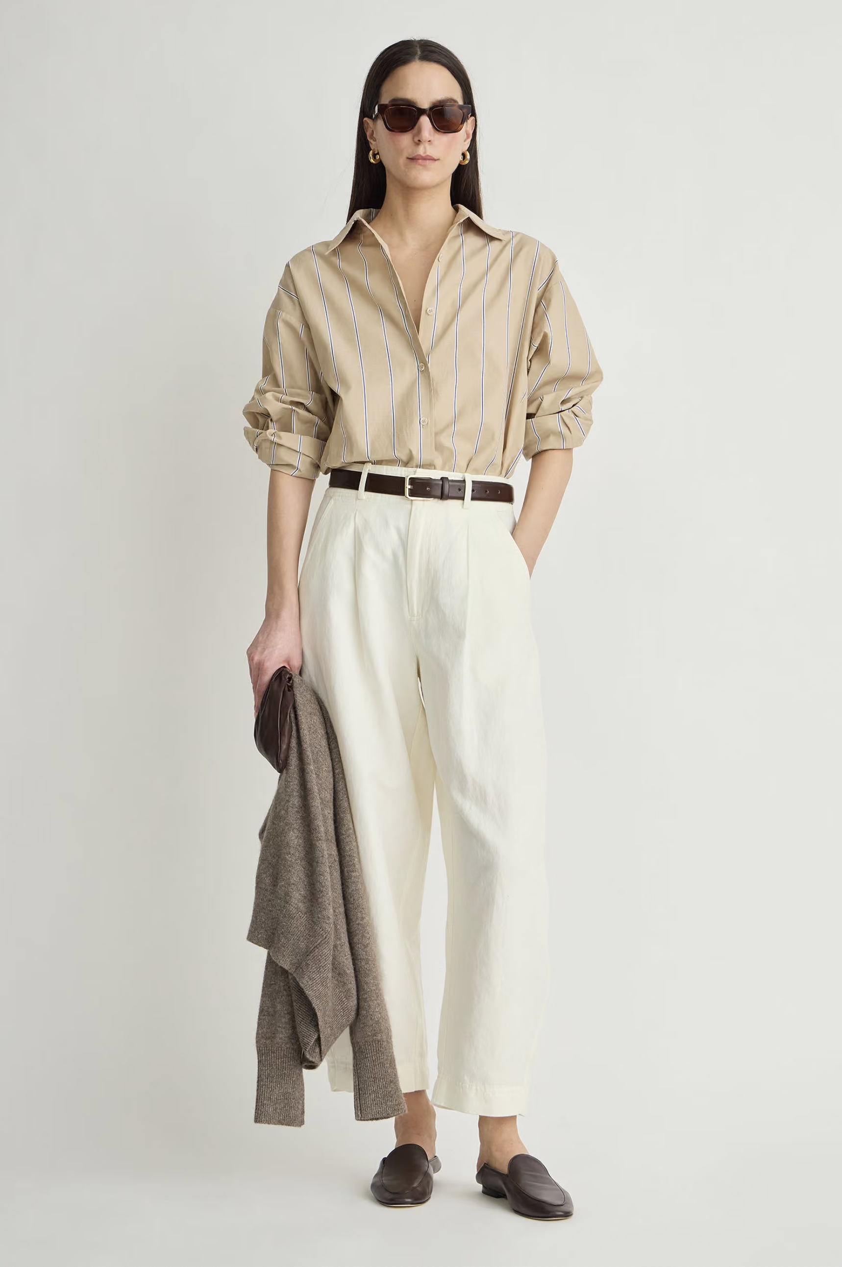 Apiece Apart Isolde Button Down styled with white pants and a brown sweater, casual modern look.