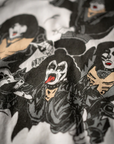 Close-up of a textile featuring a printed design of KISS ARMY WANTS YOU! band members in their iconic makeup and costumes, influenced by Arizona-style patterns by Made Worn.