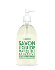 A clear plastic pump bottle of Cie Luxe Brands Liquid Soap16.7oz with "Savon Liquide de Marseille Extra Pur" written in green text. The soap, made from vegetable oils, is clear and the label indicates it is a rosemary vitamin formula, made in France.