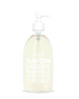 A clear bottle of Liquid Soap16.7oz with a white pump dispenser. The label reads "Cie Luxe Brands, Liquid Soap16.7oz Extra Pur, Fleur de Coton" in white text. Enriched with vegetable oils from Provence, the transparent light yellow soap exudes a touch of luxury.