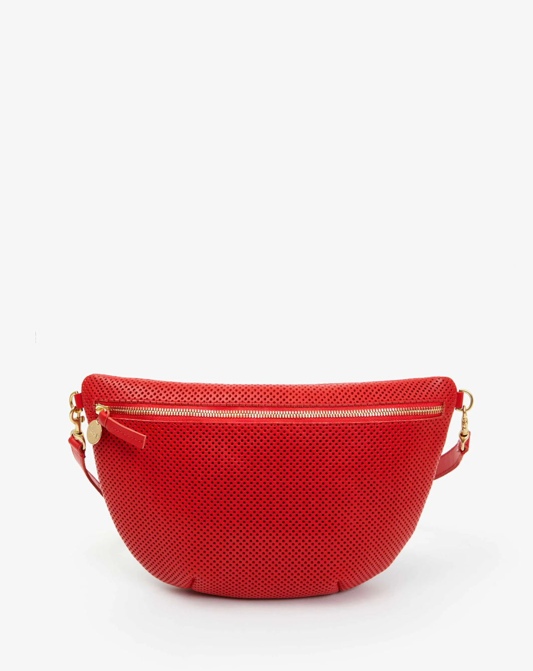 Introducing the Grande Fanny Perf by Clare Vivier: a stylish red crossbody bag featuring a perforated texture and a gold zipper closure on the front. The bag showcases elegant gold hardware, an adjustable strap, and a small decorative gold charm affixed to the zipper pull. The background is plain white.