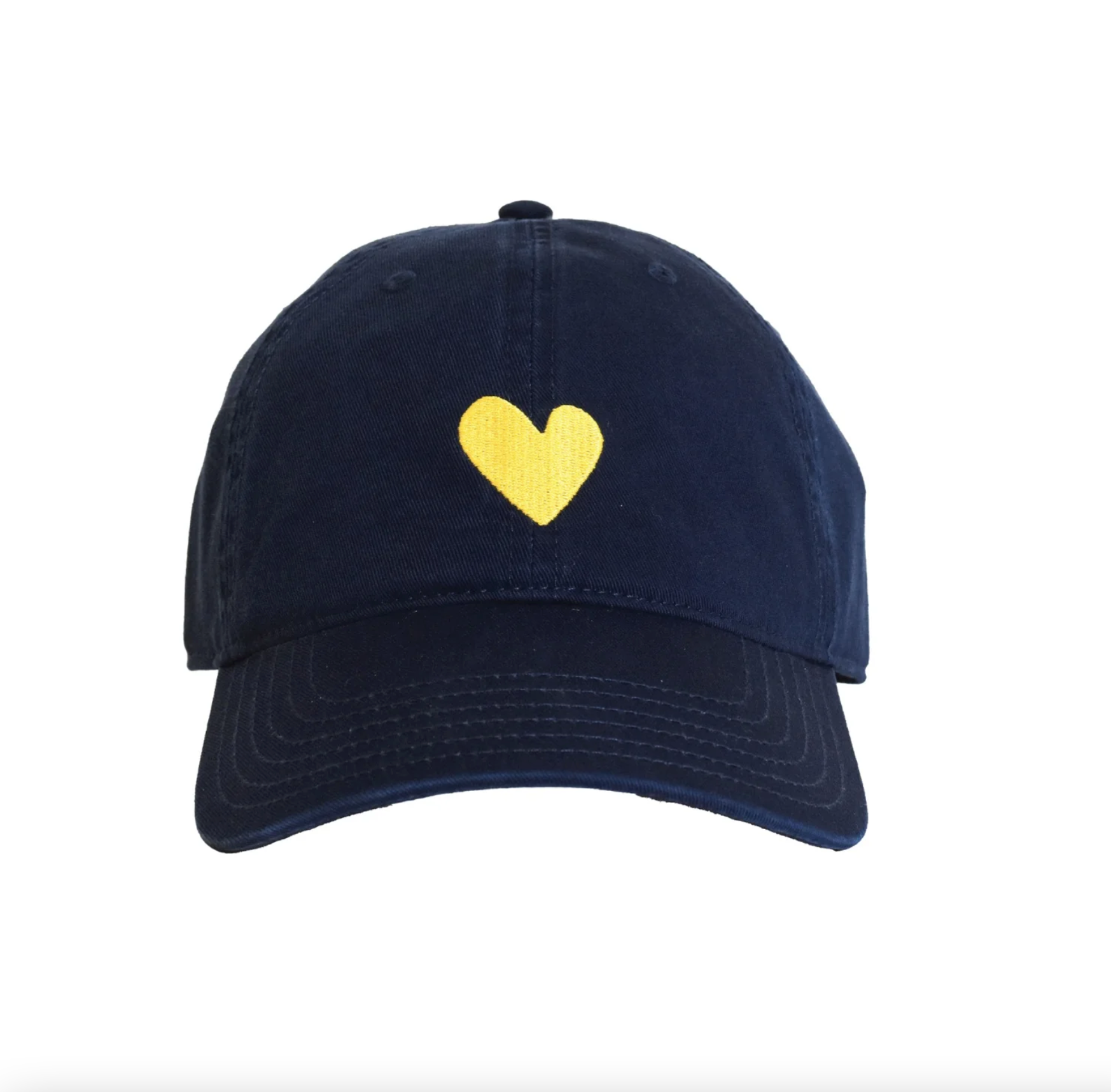 The Embroidered Heart Hat by Kerri Rosenthal, a quintessential collegiate-style navy blue baseball cap, showcases a small yellow heart embroidered at the front center. It features a curved brim and noticeable stitching along the panels and edges against a plain white background.