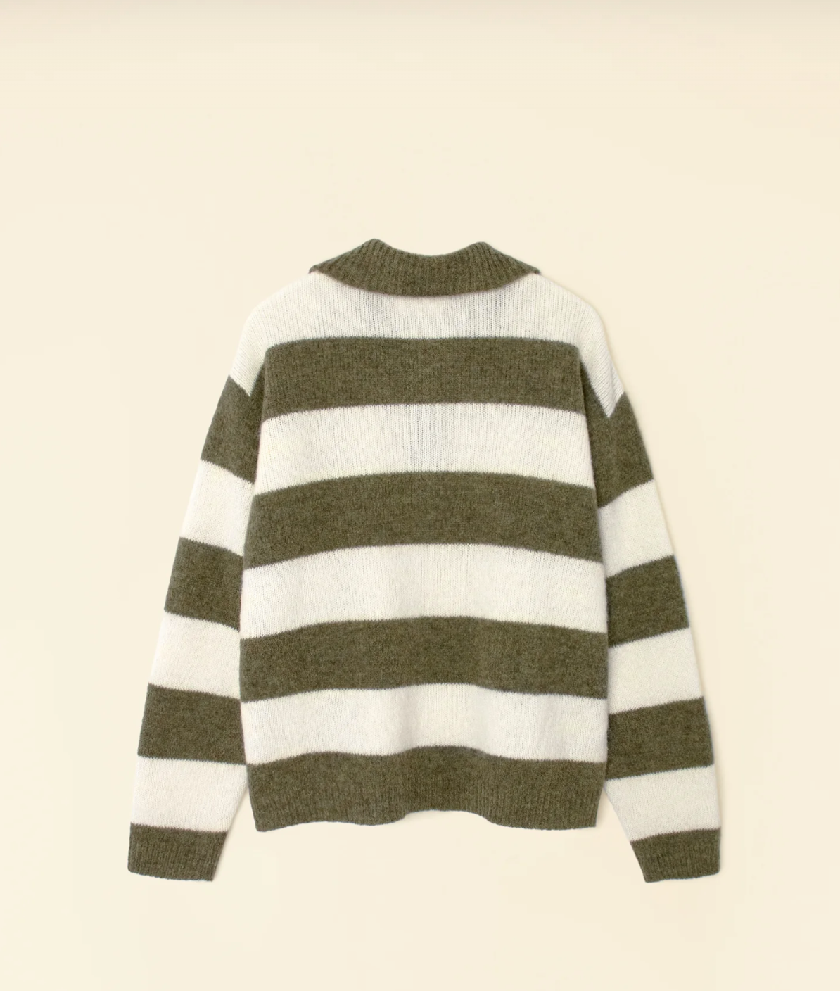 The Benton Sweater, created by Xirena, showcases a flat display of green and white horizontal stripes. Crafted from an opulent baby alpaca blend, it features a rounded neckline with alternating wide bands of white and green set against a light beige background.