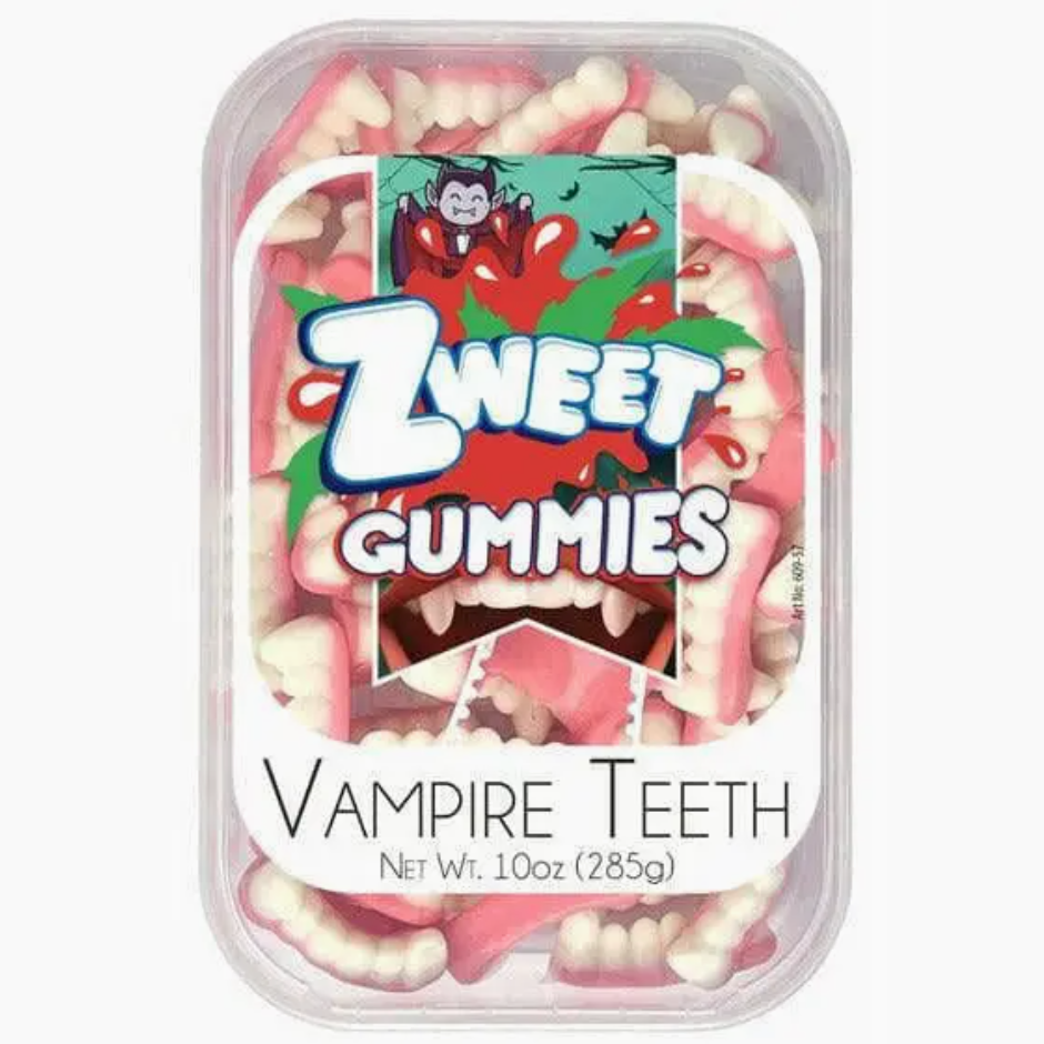 A rectangular container labeled &quot;Halloween Gummies&quot; from the brand Faire holds pink and white gummy candies shaped like vampire teeth. The label features a cartoon vampire with fangs and a cape, emphasizing their fruity flavor. The container states &quot;Vampire Teeth, Net Wt. 10oz (285g)&quot; and comes in a shareable batch for all to enjoy.