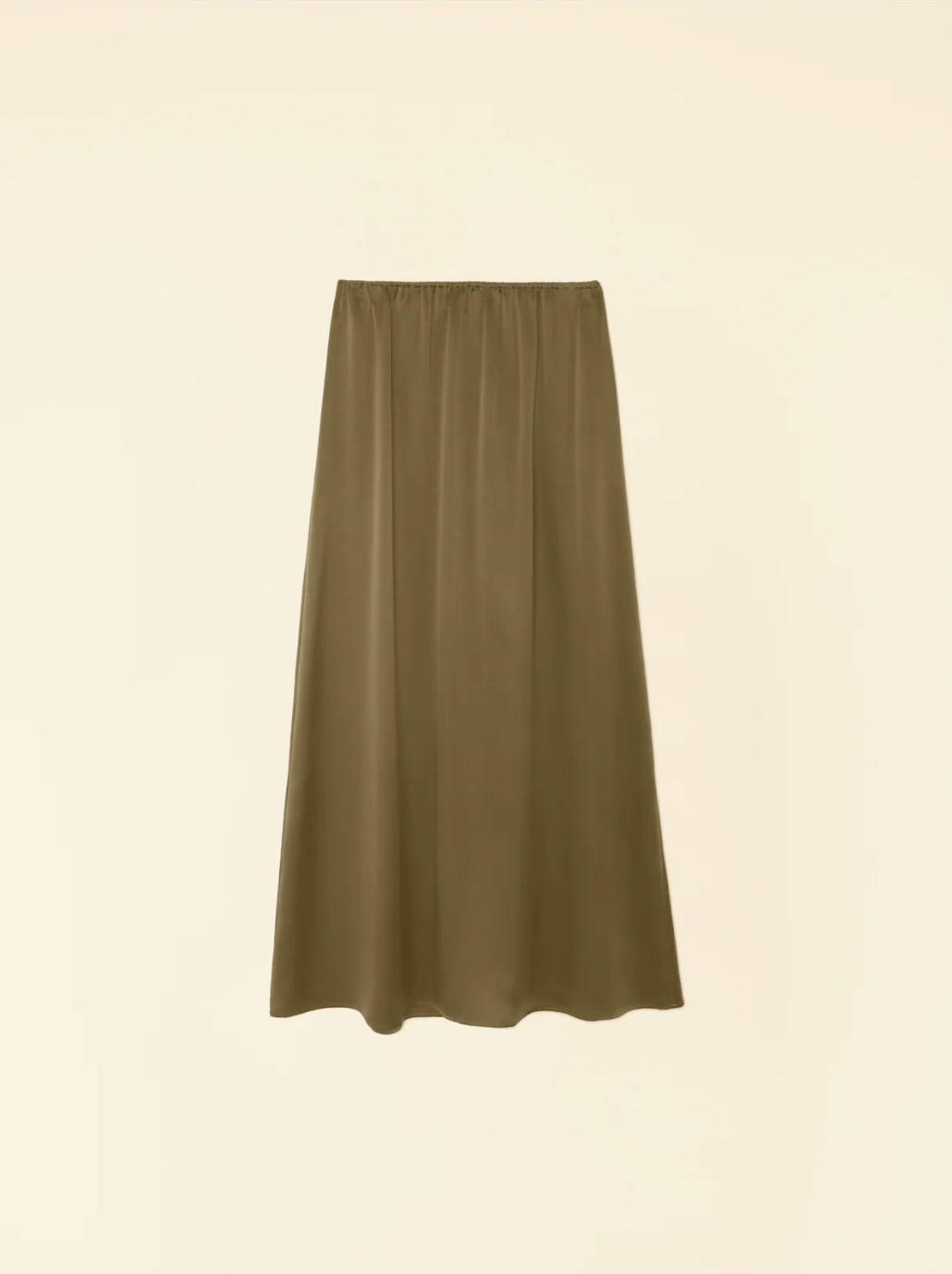 The Sela Skirt by Xirena, a midi-length, olive-green piece with a straight cut, is shown against a plain beige background. Made of luxurious silk charmeuse and featuring an elastic waistband, this slip-on skirt exudes effortless elegance.