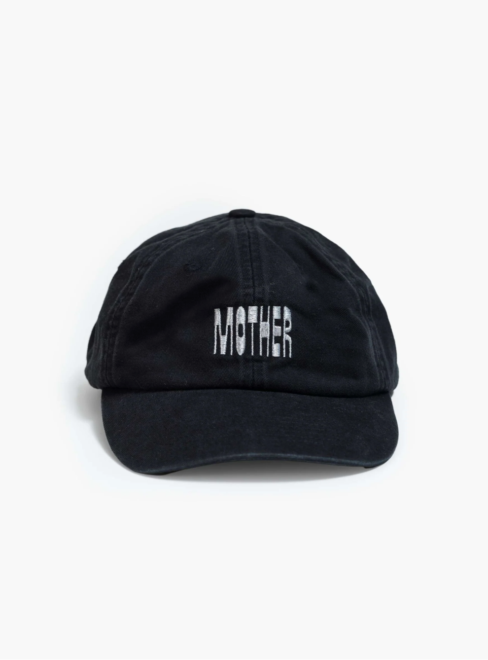 A black cotton "Hats Off" dad hat by Mother features "MOTHER" embroidered in white on the front, displayed stylishly on a plain white backdrop to highlight the brand's unique flair.