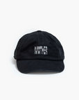 A black cotton "Hats Off" dad hat by Mother features "MOTHER" embroidered in white on the front, displayed stylishly on a plain white backdrop to highlight the brand's unique flair.