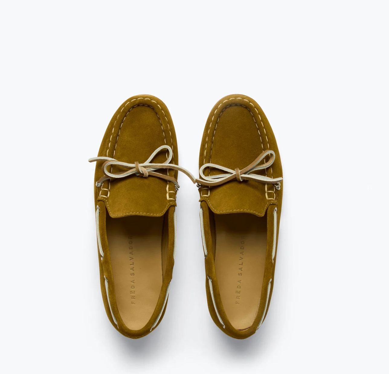 Top view of Freda Salvador's MORGAN Loafers in brown suede, featuring white stitching and tan laces on a light background. These loafers blend Italian leather craftsmanship with a classic boat shoe design, showcasing rounded toes and decorative lace details.