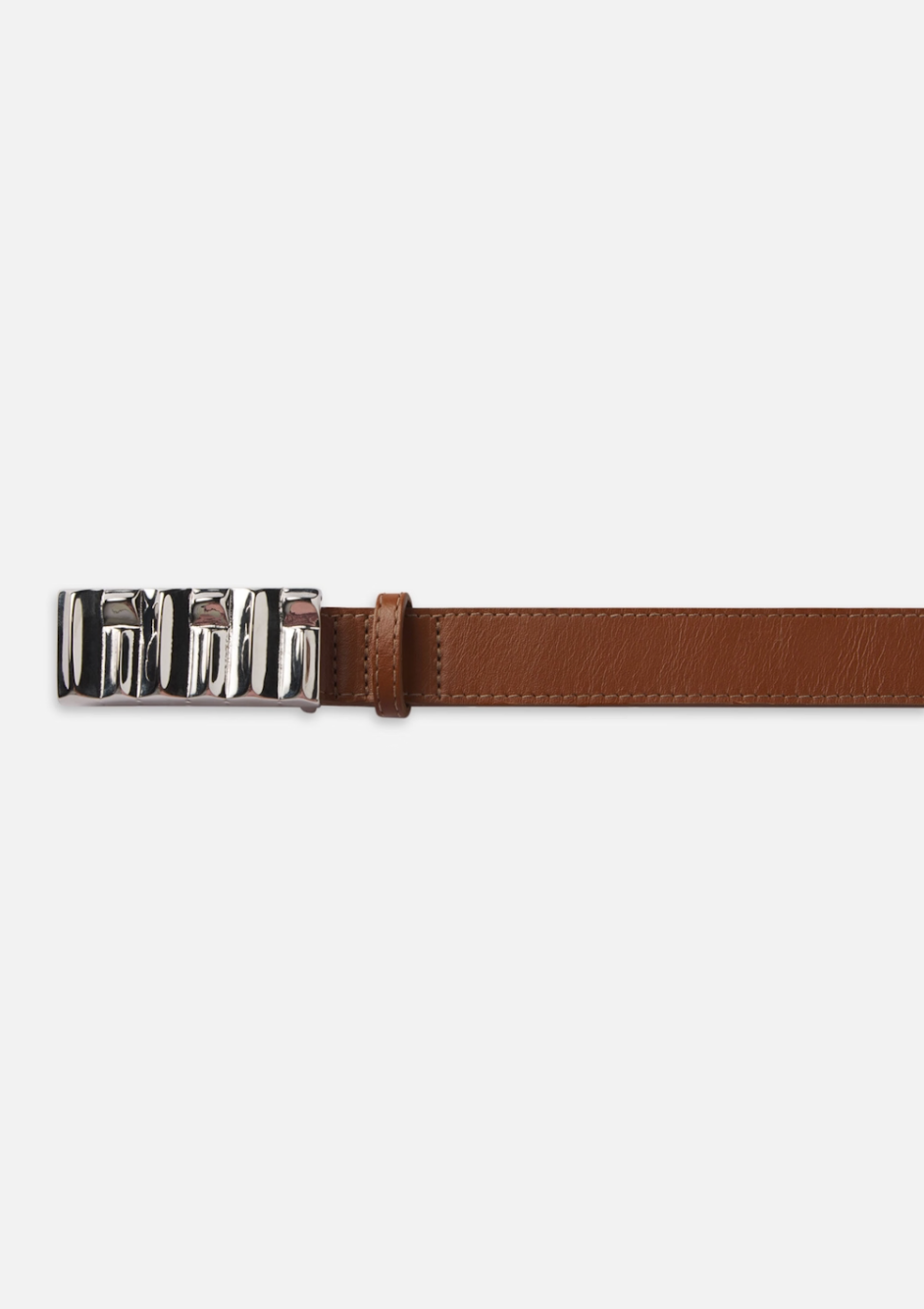 The Sculptural Belt by FRAME is a brown leather belt with a shiny silver ridged bar buckle featuring an abstract interlocking design, displayed prominently on the left of a plain white background.