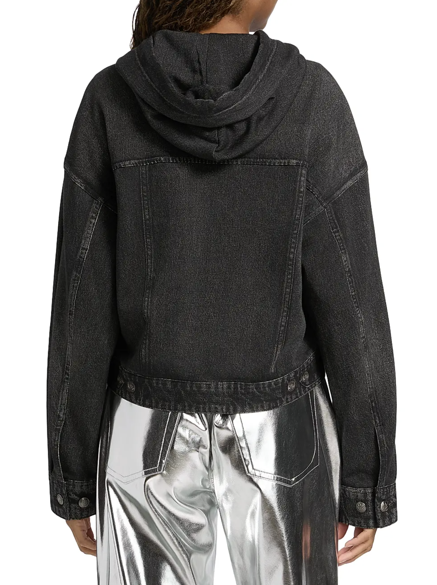 A person is seen from the back wearing a black Rag & Bone miramar terry hood trckr jckt and shiny silver metallic pants, set against a plain white background.